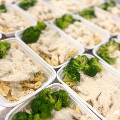 Delicious Penne Alfredo with perfectly cooked noodles, a generous dusting of parmesan and a fresh side of broccoli.