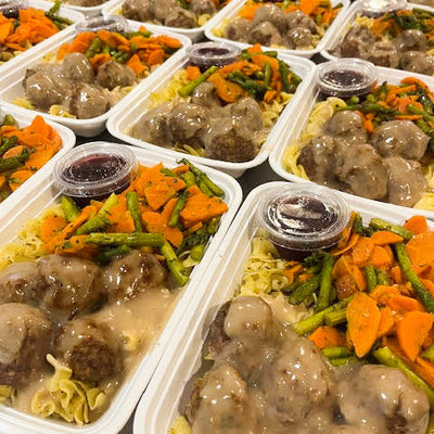 Perfectly cooked Swedish meatballs over pasta in a creamy white gravy sauce, paired with well seasoned carrots and asparagus.
